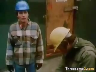 Construction workers в a вінтажний трійця