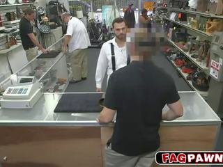 Dude blows a johnson behind counter in a shop